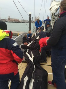 Putting the Yankee to bed.  That sail is a bit long and heavy.  Help someone get me out from under here!