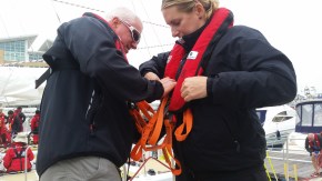 Helping each other get lifejackets ready. Amazing we do not even move boat at doc Amazing, we do not even move the boats from one dock to next without our lifejackets.