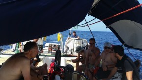 Relaxing uder some shade made by our horse blanket that covers the main in port.