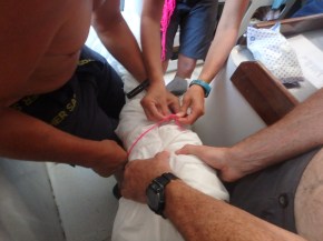 w yes, teamwork helps. We actually do have 2 to 3 people. Two to roll it up tightly and one to tie.