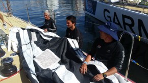 Getting sail bag ready to begin flaking the sail 