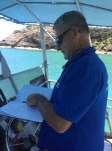Wayne making notes after pickup in his office on board 