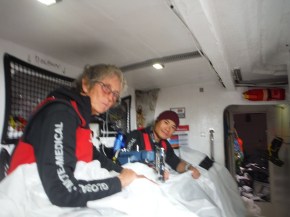 Jason and Linda sewing it back together. Jason sewing and Linda running it through.