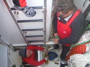 Mark and Justin cleaning out bilges in sail locker