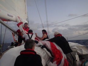 Team work bringing in the kite