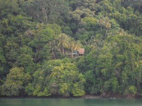 House in the trees along the shore on the way into fueling stop.